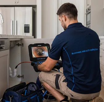 Clearing a blocked sink at a Homebush West property